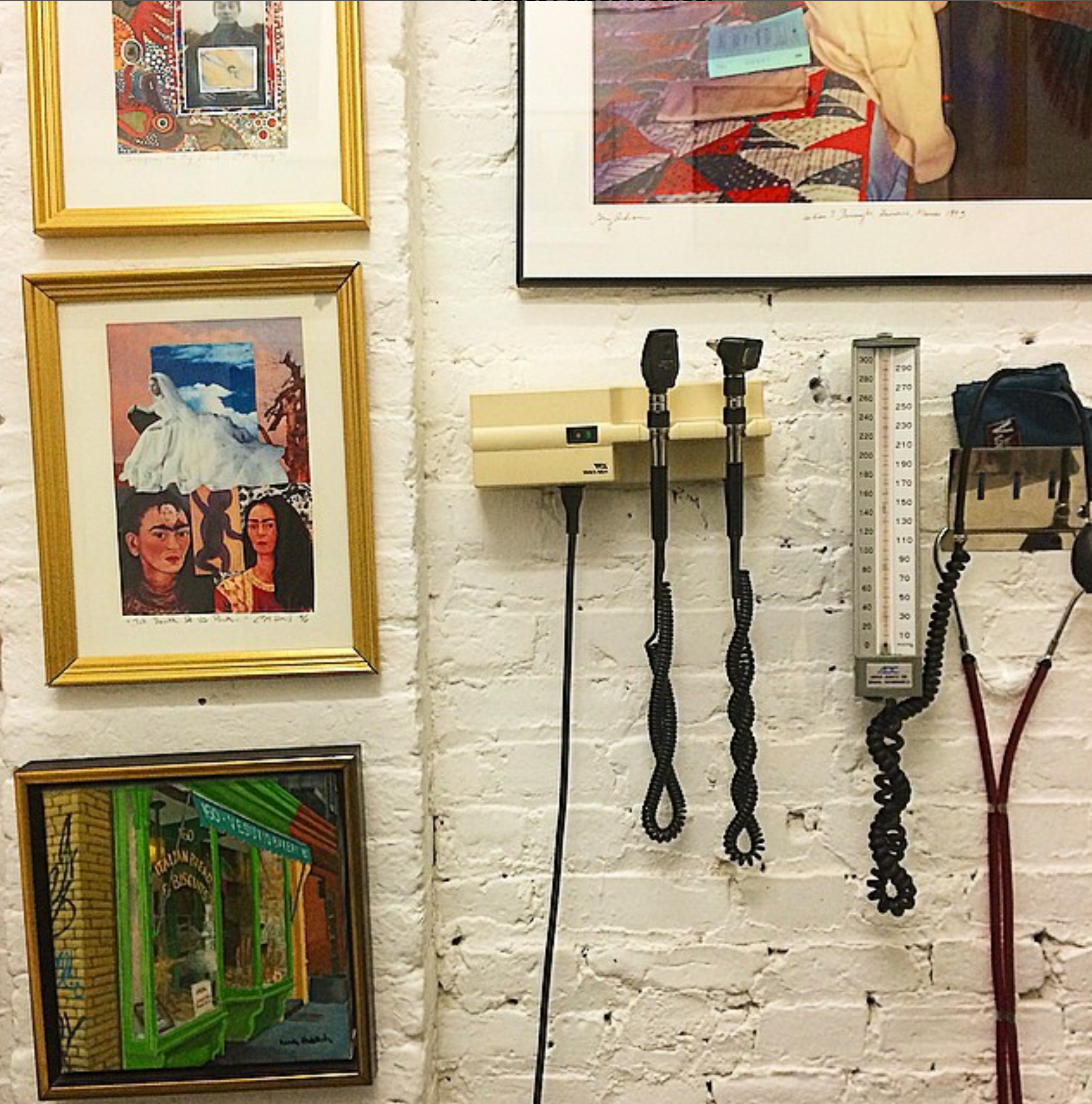 Framed art beside medical instruments