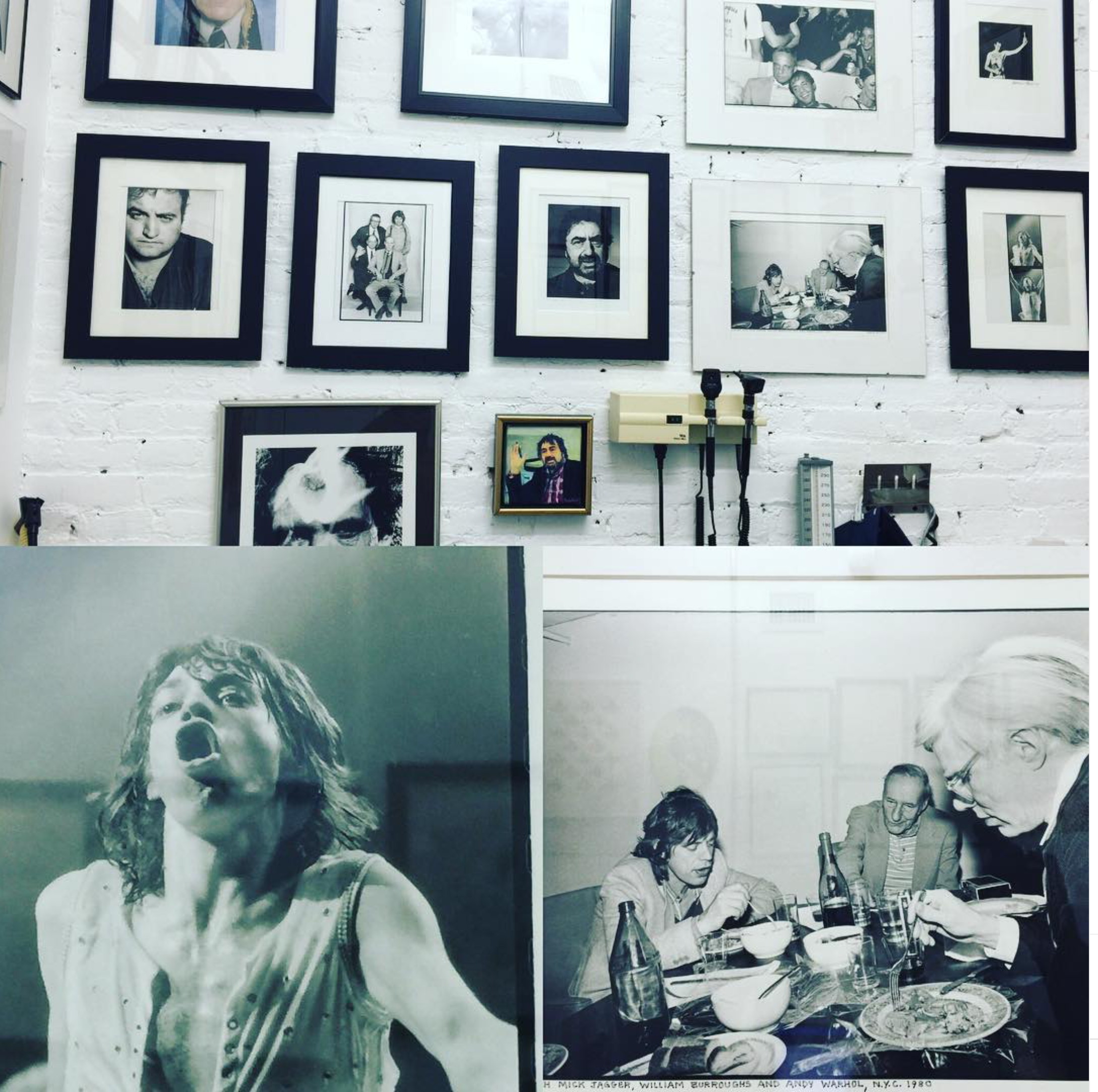 Portrait photographs displayed on a white brick office wall